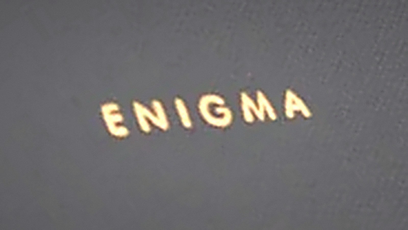 Gold foil ENIGMA stamp, close up