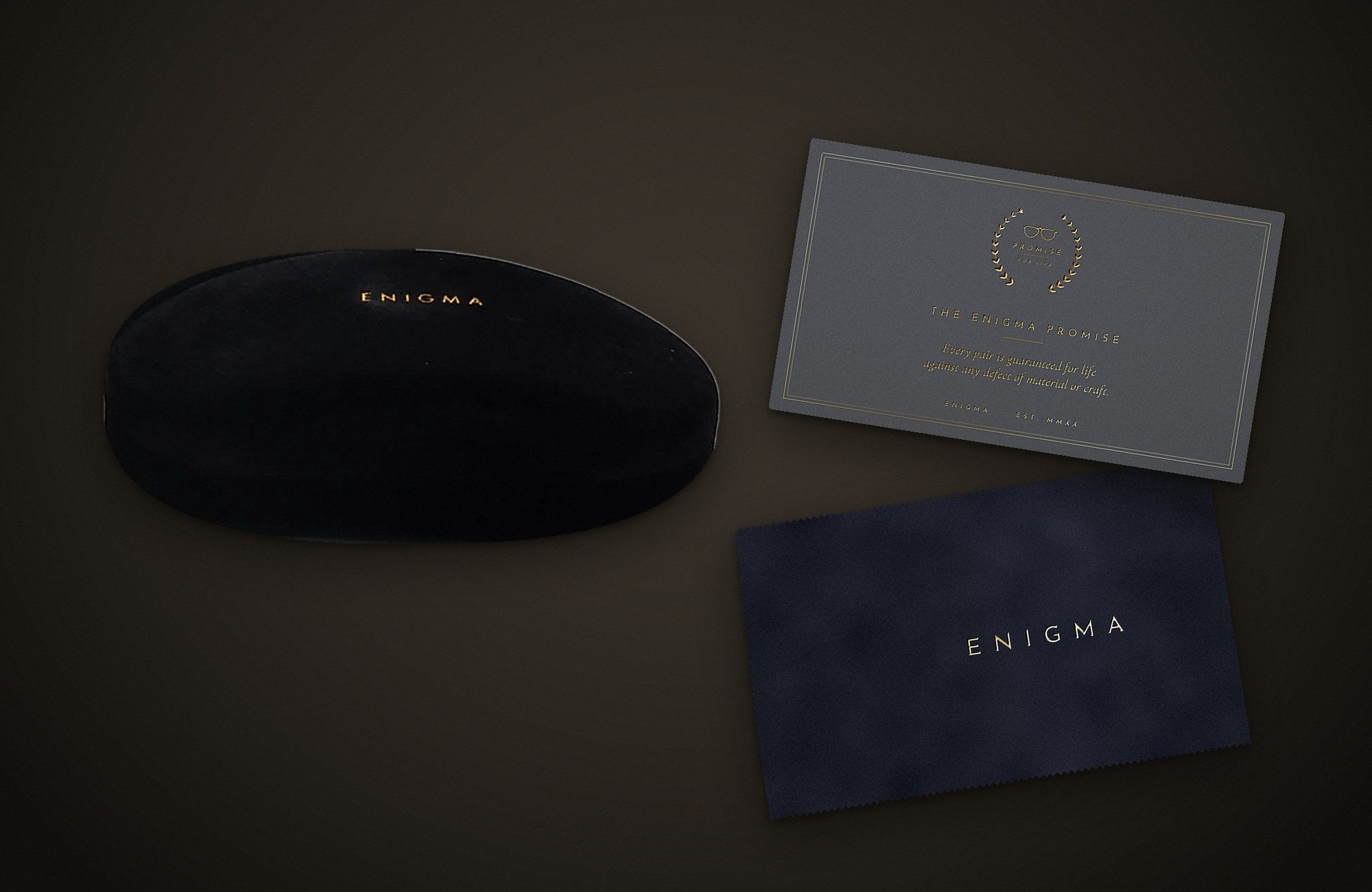 The ENIGMA box, velvet case, pouch, cloth and Promise card
